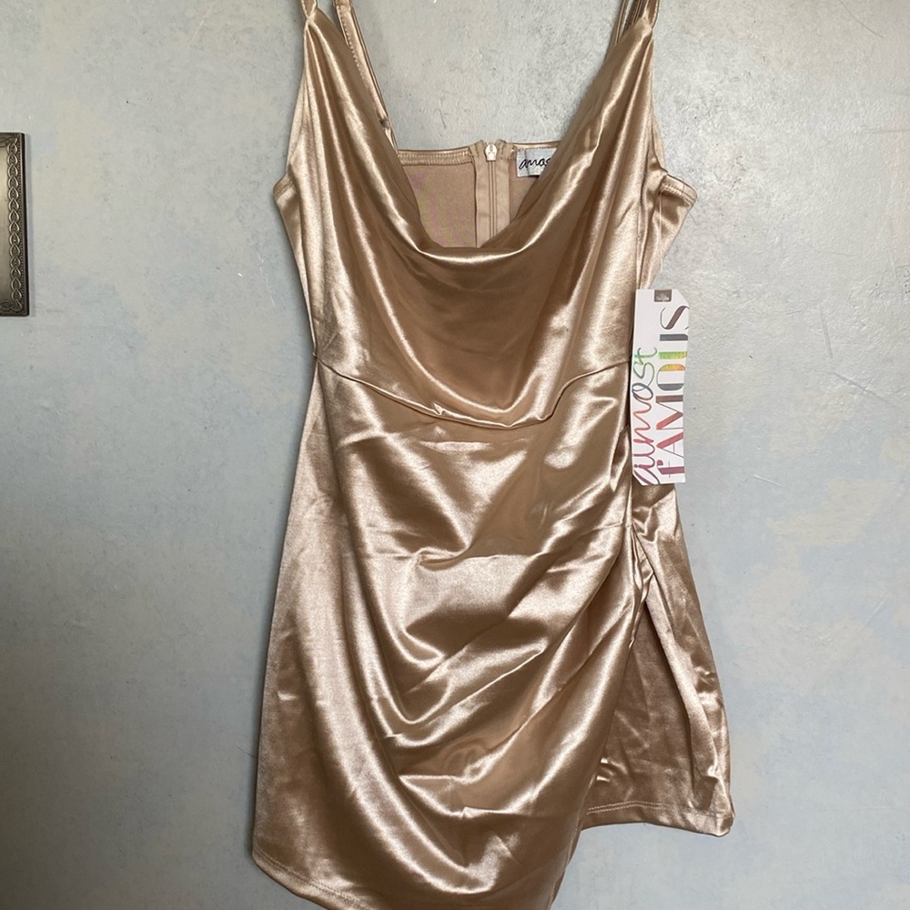 Champagne/gold piece that is shorts in the bottom but looks like a dress